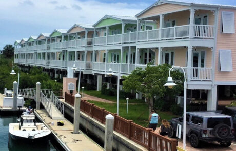 Outside boat slip and parking lot. Caribbean color buildings. Opens larger image in a gallery.